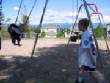 May2007/8_Riley_pushing_Megan_at_the_swing_park.jpg