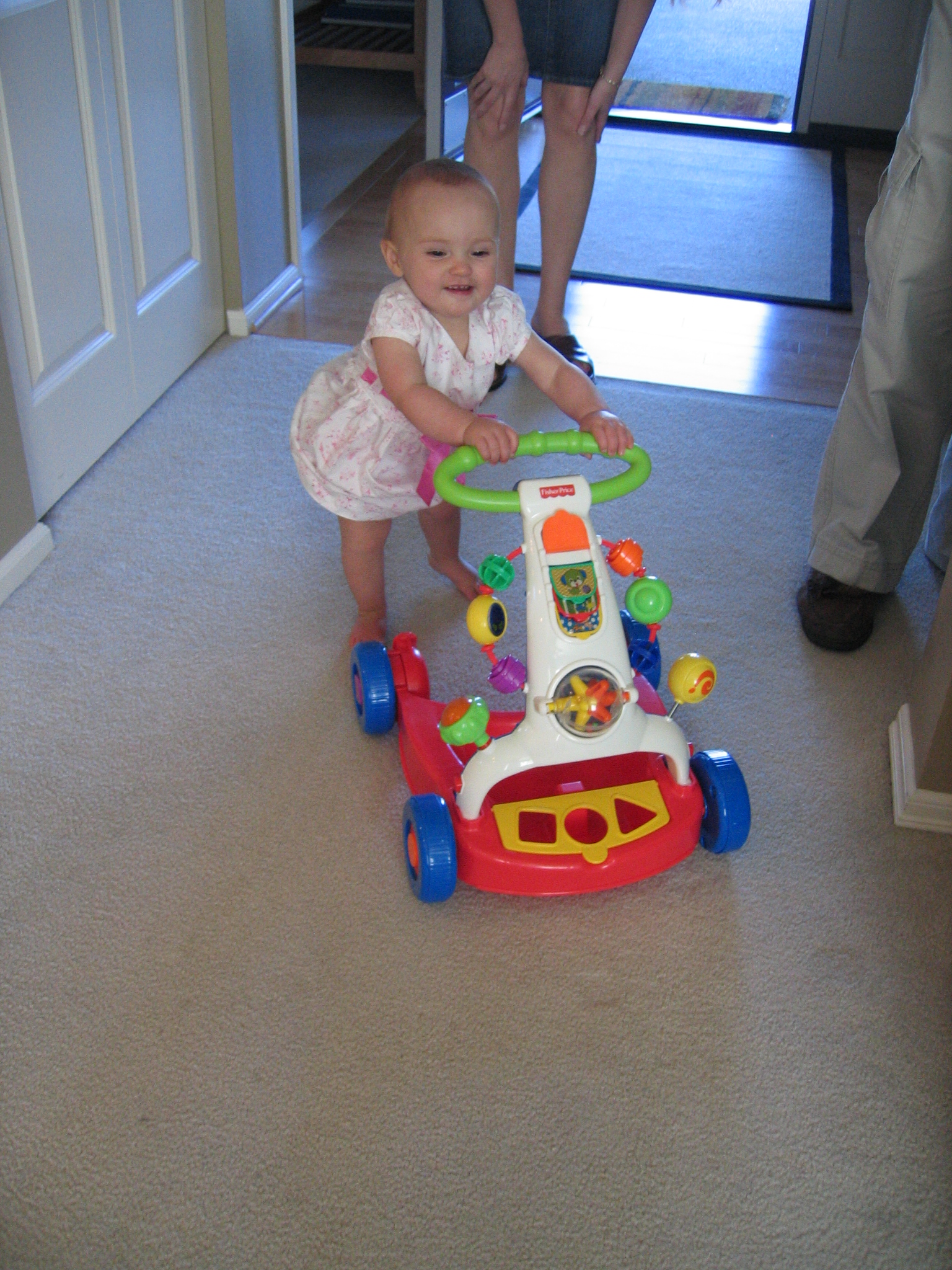 Megans1stbday/02_Megan_trying_out_her_new_walker.jpg