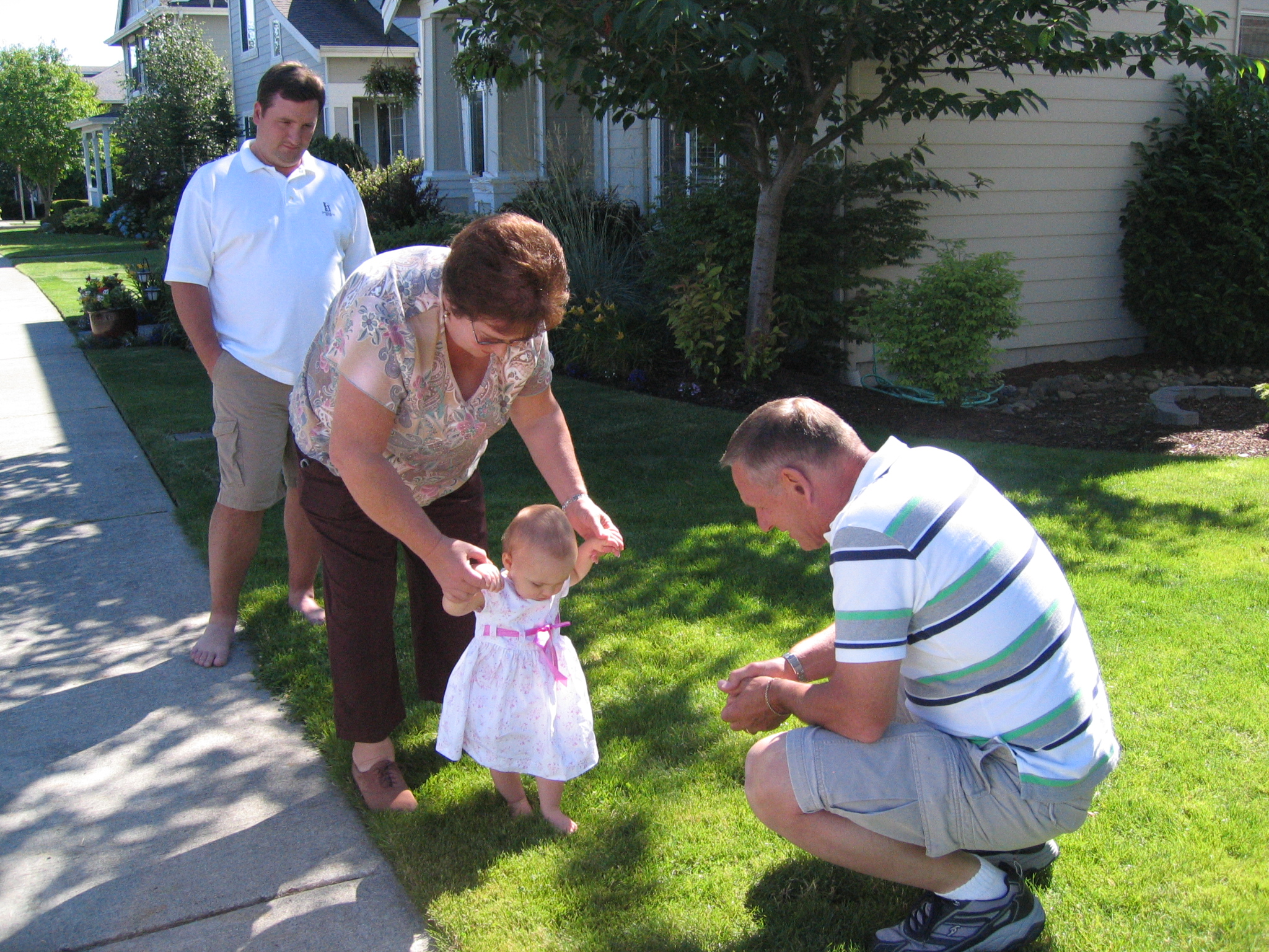 Megans1stbday/07_Megan_with_Grandma_Mari_and_Grandpa_Ken.jpg