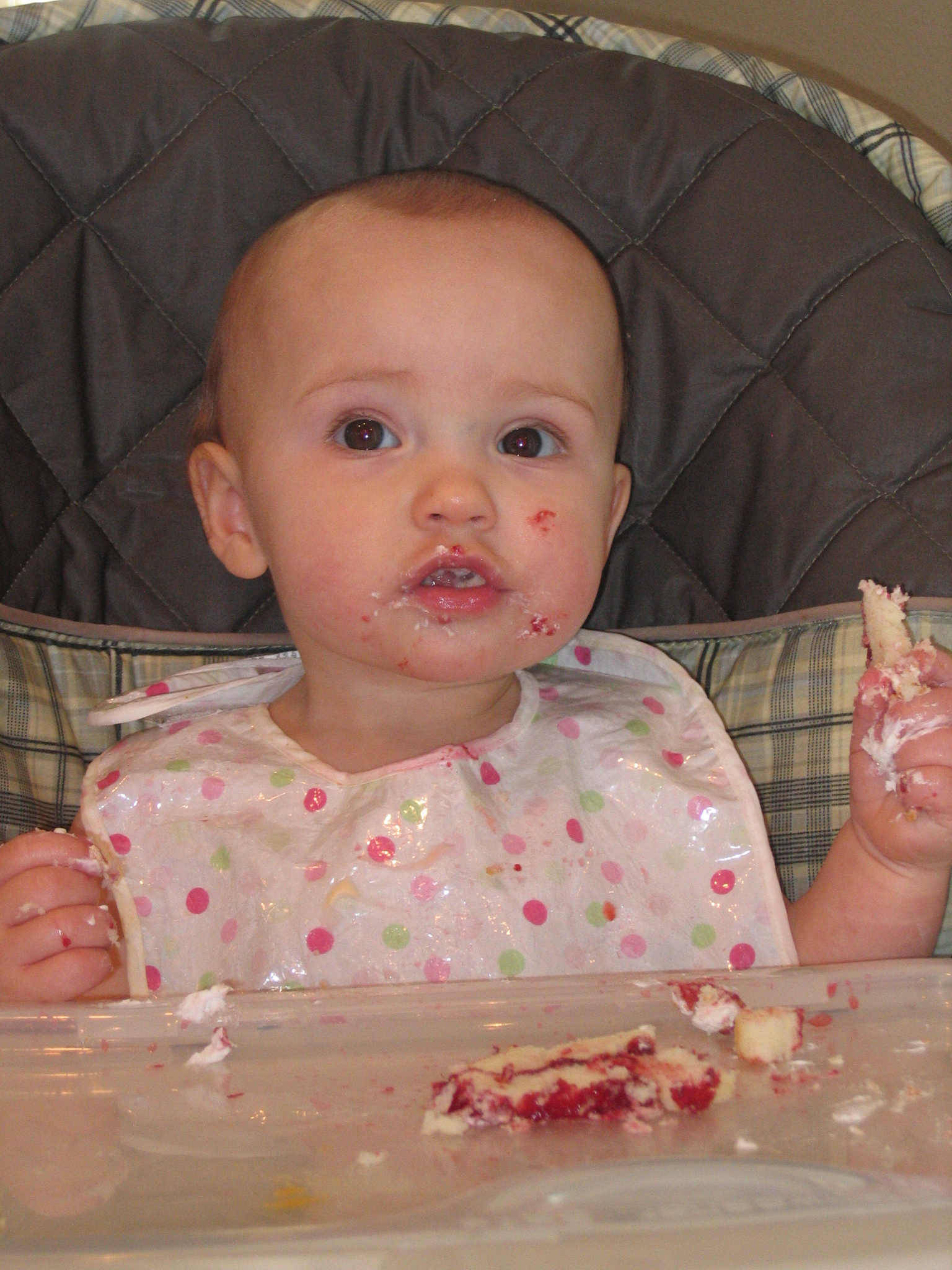 Megans1stbday/19__Megan_eating_birthday_cake.jpg