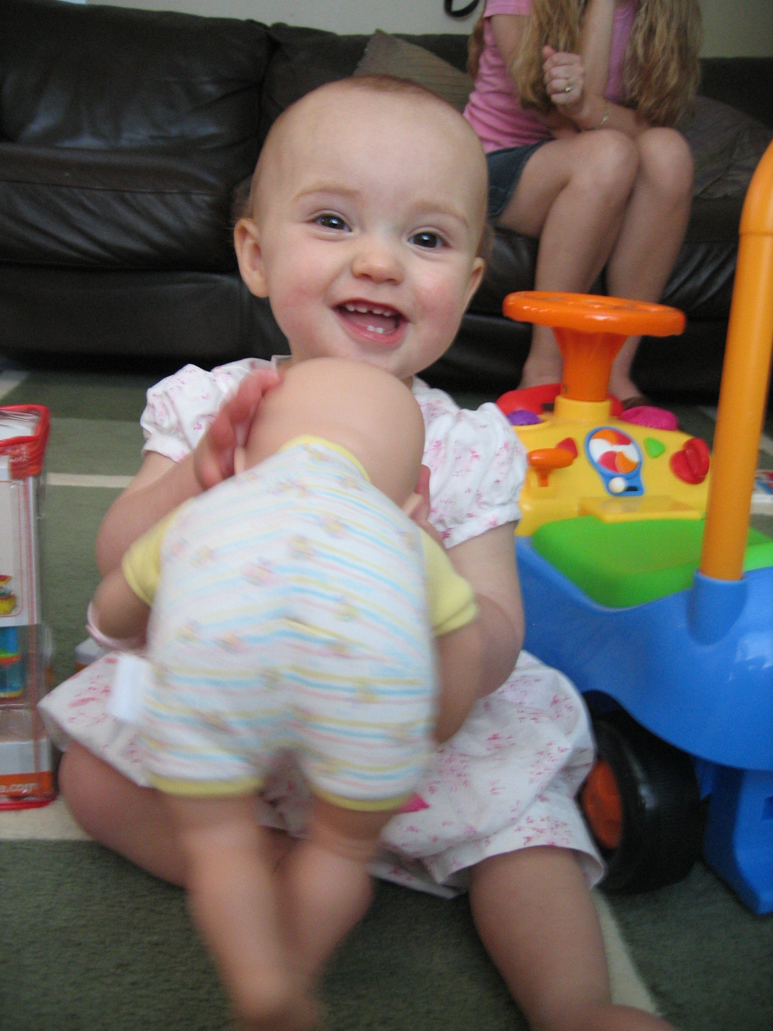 Megans1stbday/26_Megan_loved_her_first_doll.jpg