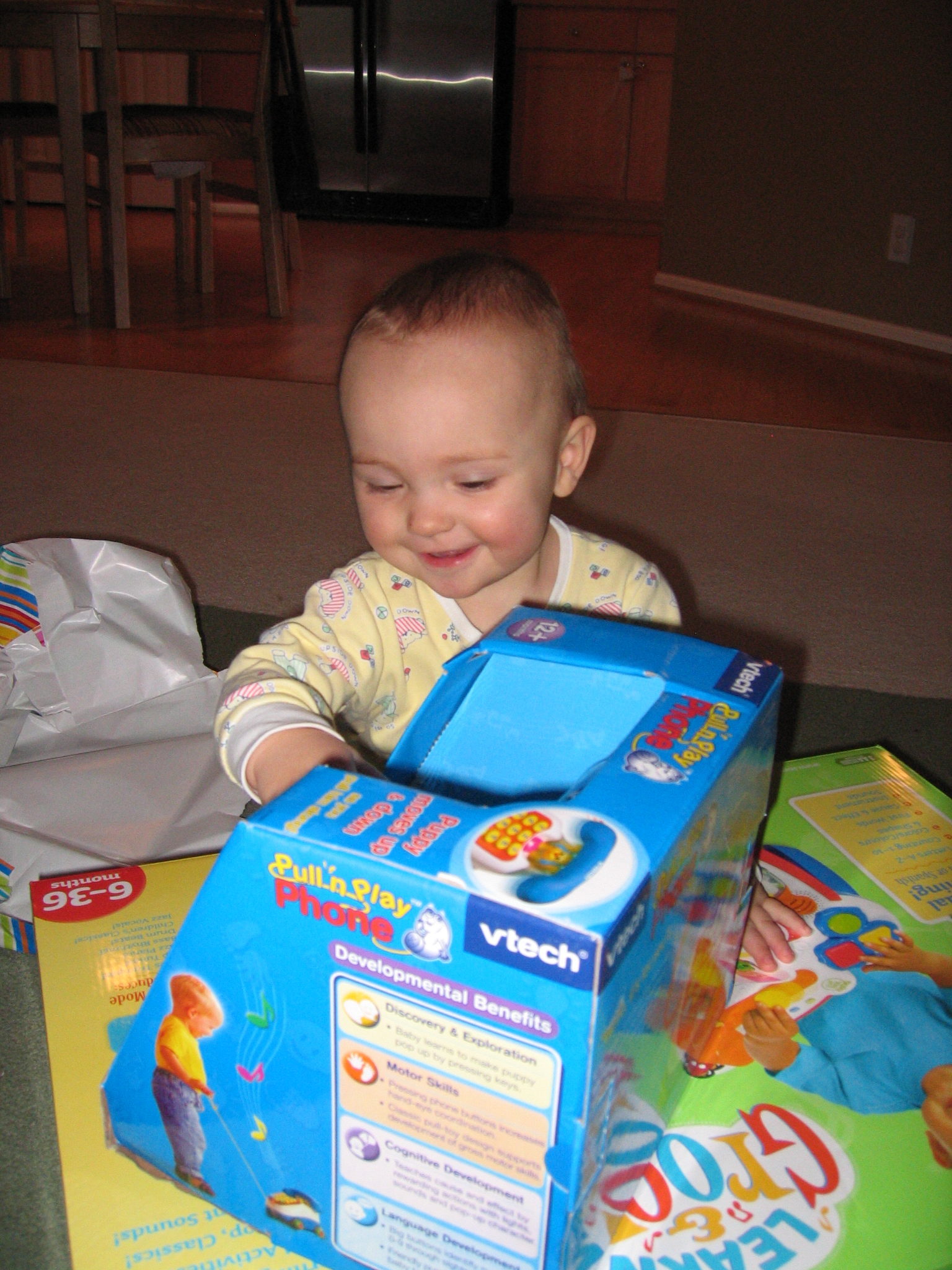 Megans1stbday/46_Megan_loves_her_new_toys.jpg